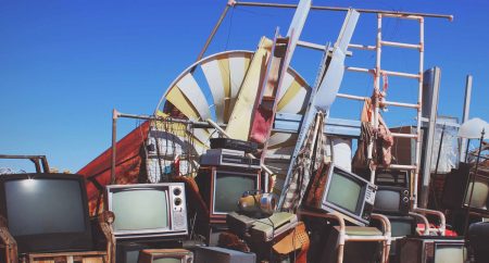 pile of broken tvs